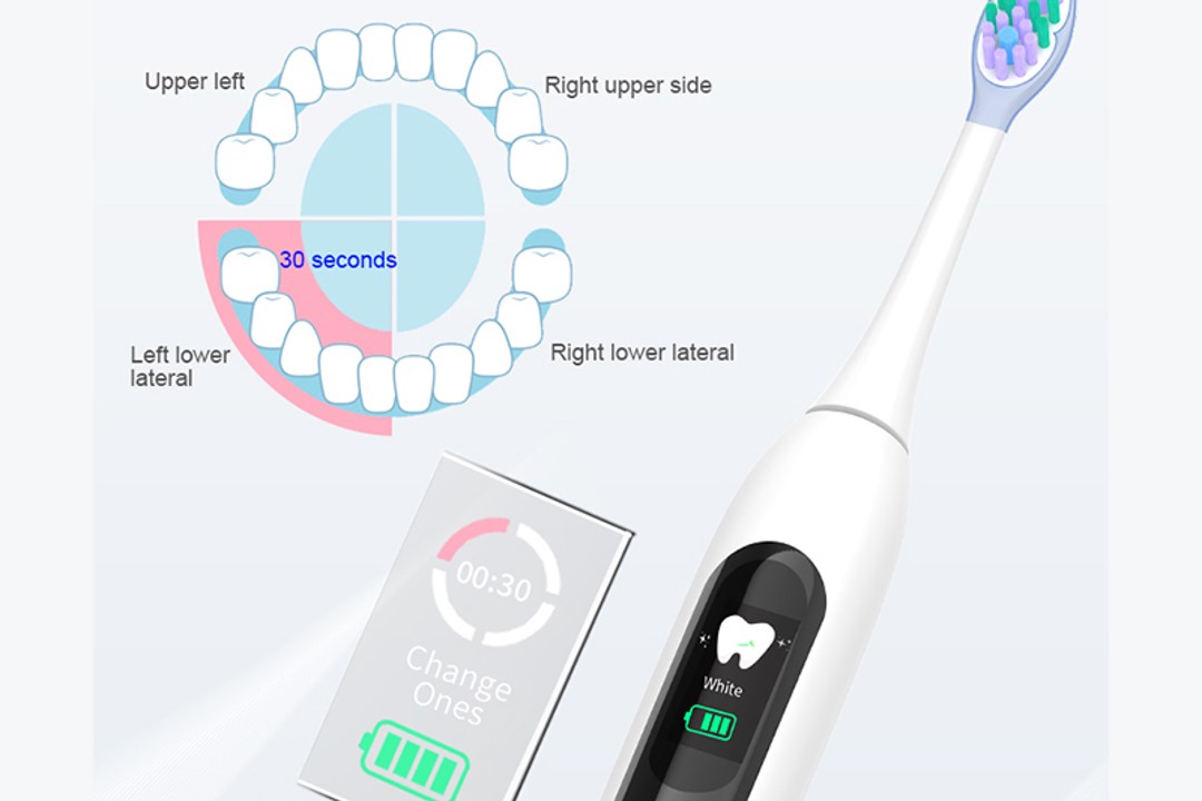 An electric toothbrush displaying a timer and pressure sensor light